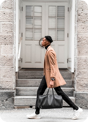 Person walking past blue door